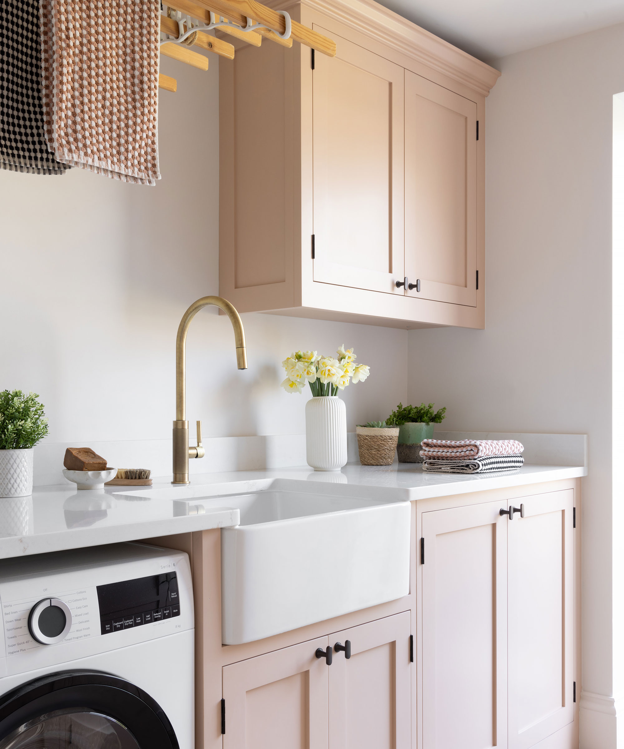 pink Shaker utility room with Belfast sink and brass tap