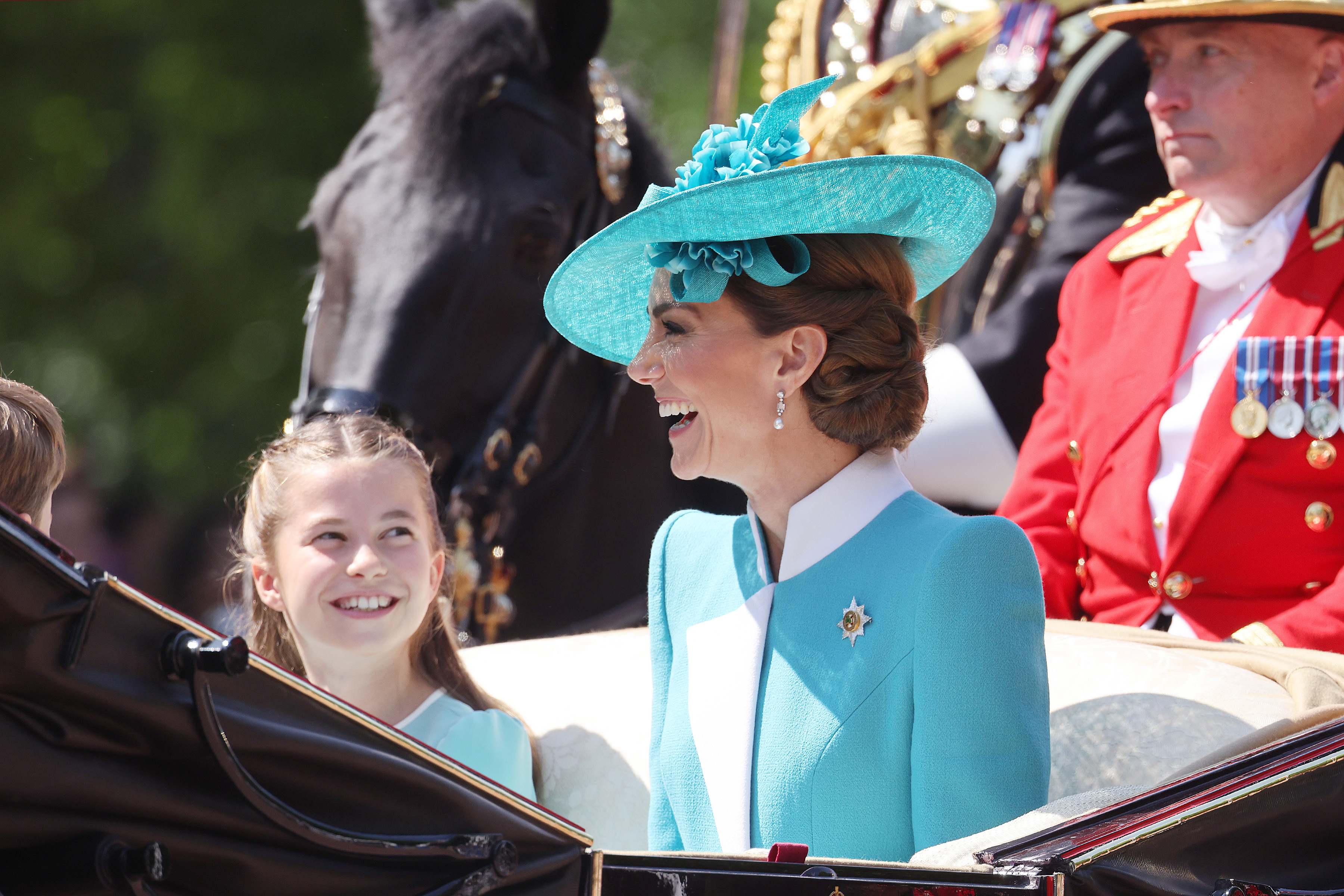 Princess Charlotte smiles at mom Princess Kate at Trooping the Colour 2025