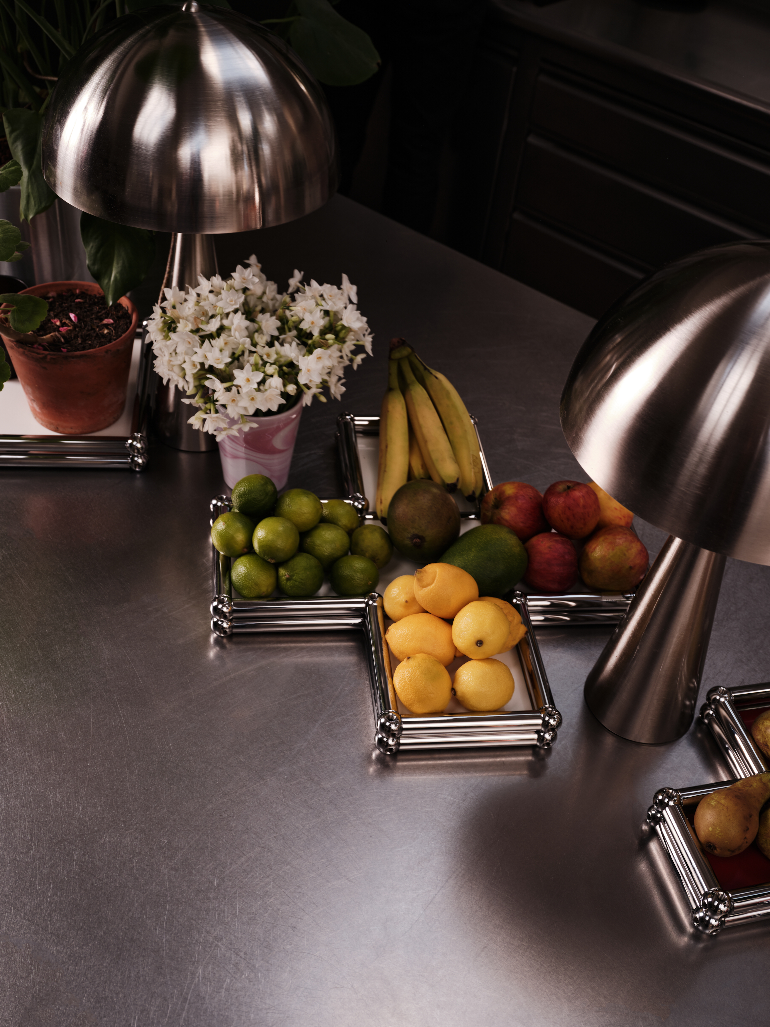 A series of shots depicting a festive Christmas tree, flowers, candles, and accessories setup.