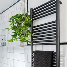 bathroom with towel window shade stand