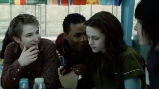 Mike, Tyler, and Eric all over Bella in the cafeteria in Twilight.