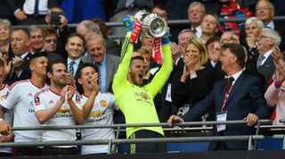 LONDON, ENGLAND - MAY 21: David De Gea of Manchester United lifts the trophy after winning The Emirates FA Cup Final match between Manchester United and Crystal Palace at Wembley Stadium on May 21, 2016 in London, England. (Photo by Shaun Botterill/Getty Images)