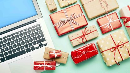 Gifts surrounding a laptop