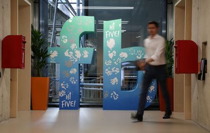 An employee at Facebook headquarters in London.