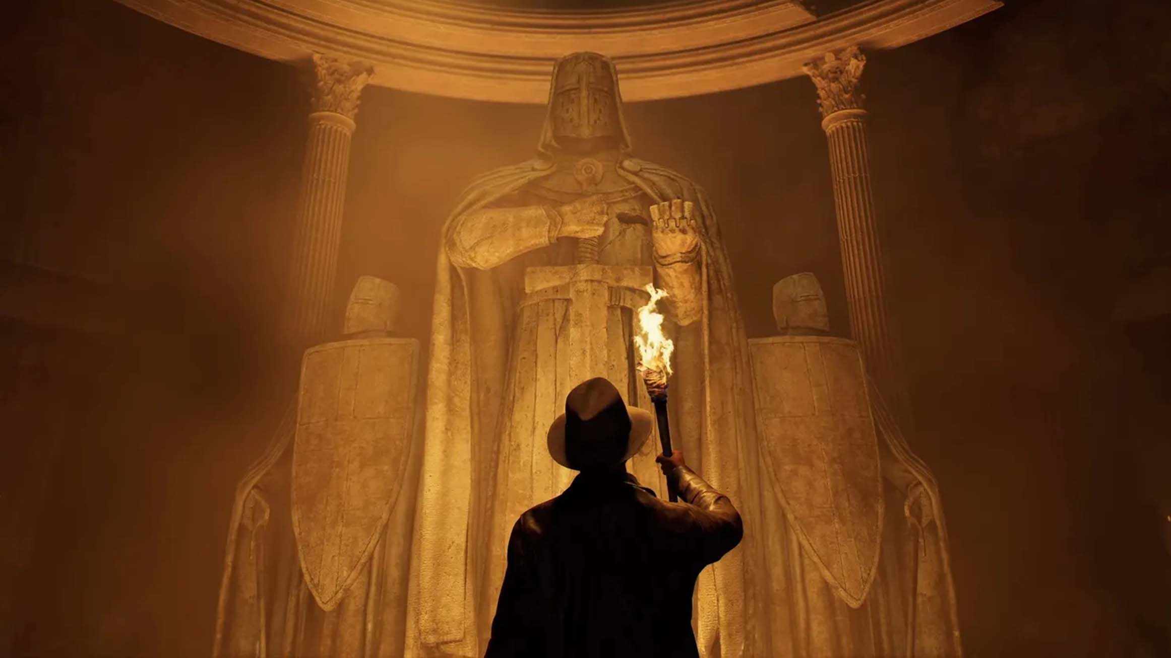 Indiana Jones holding up a torch in front of three statues depicting armored knights from Indiana Jones and the Great Circle: The Order of Giants DLC.
