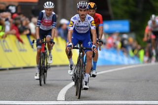Team Deceuninck rider Frances Julian Alaphilippe crosses the finish line of the second stage of the 72nd edition of the Criterium du Dauphine cycling race 135 km between Vienne and Col de Porte near Sarcenas on August 13 2020 Photo by Justin Setterfield POOL AFP Photo by JUSTIN SETTERFIELDPOOLAFP via Getty Images