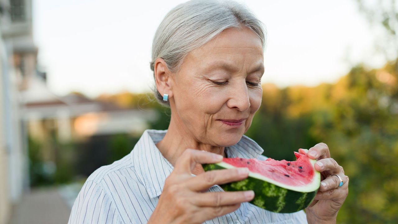 Woman eating watermelon