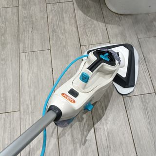 Vax Steam Fresh Combi S86-SF-C Steam Mop being used on a bathroom floor