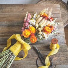 how to dry flowers Colourful bunch of dried flowers tied with yellow ribbon