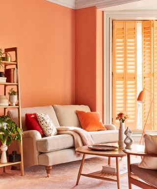 Orange living room with painted window shutters