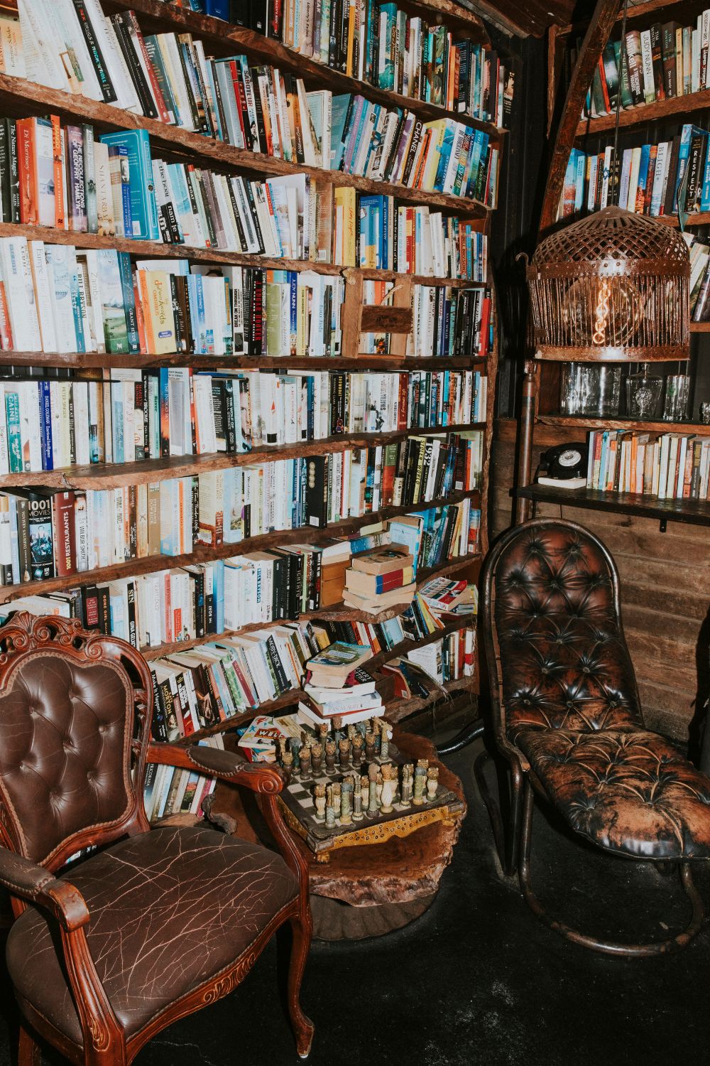 Golden Moments - Vintage library corner with leather chairs and wooden shelve - TVS