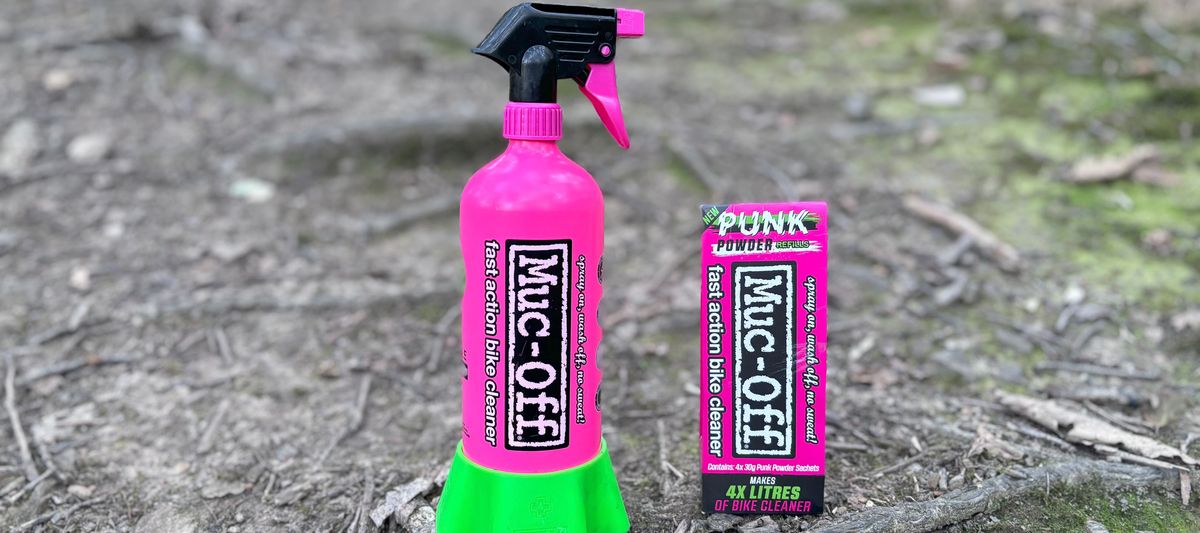 The Muc-Off Bottle for Life with its bright pink alloy bottle and green holder