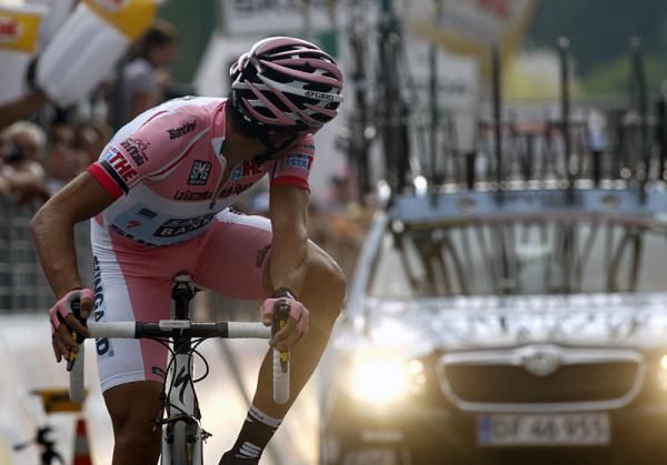 Alberto Contador looks back to see his time on the electronic display over the finish line.