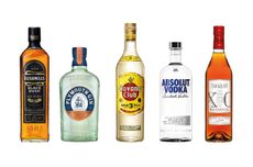 Five bottles of spirits against a white background