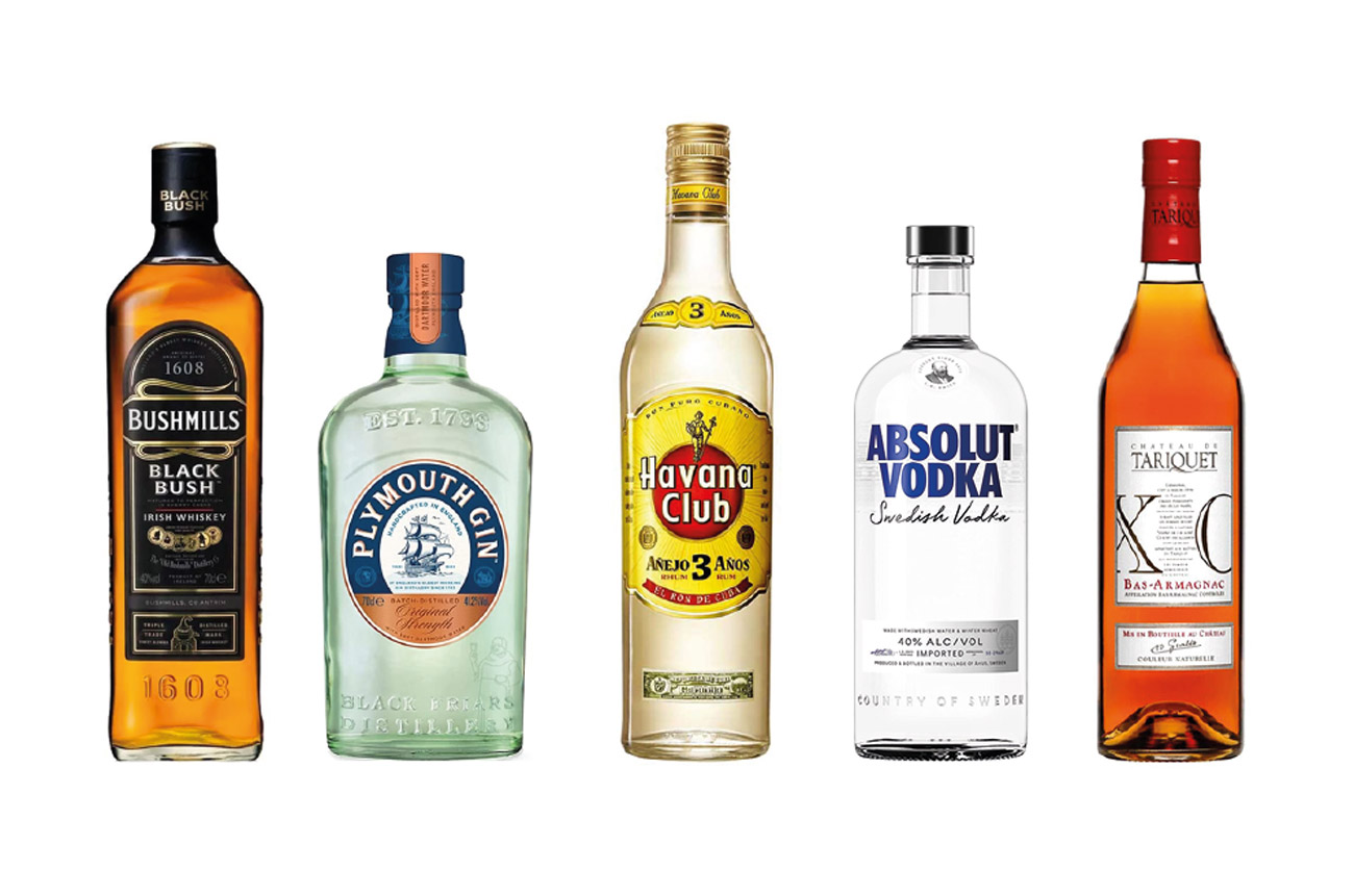 Five bottles of spirits against a white background
