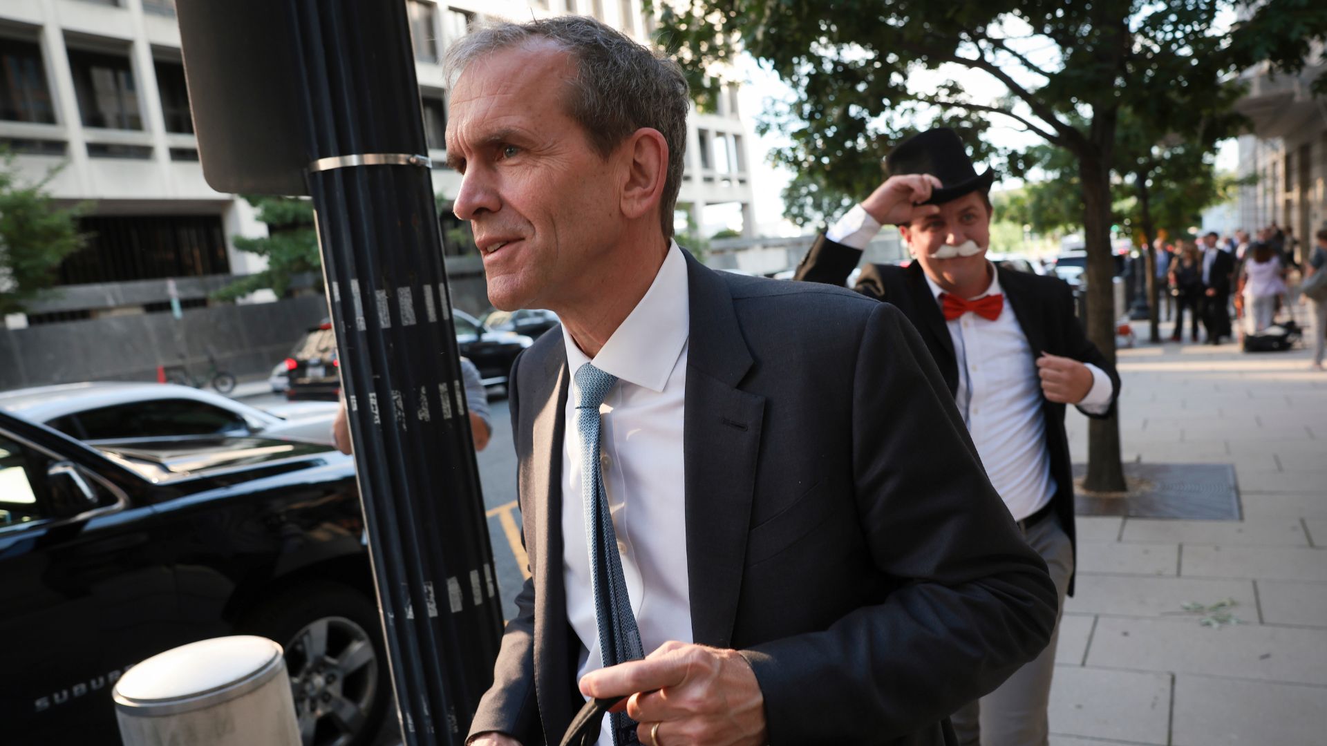 WASHINGTON, DC - SEPTEMBER 12: Kent Walker, President of Global Affairs at Google and Alphabet, trailed by Ian Madrigal dressed as the 