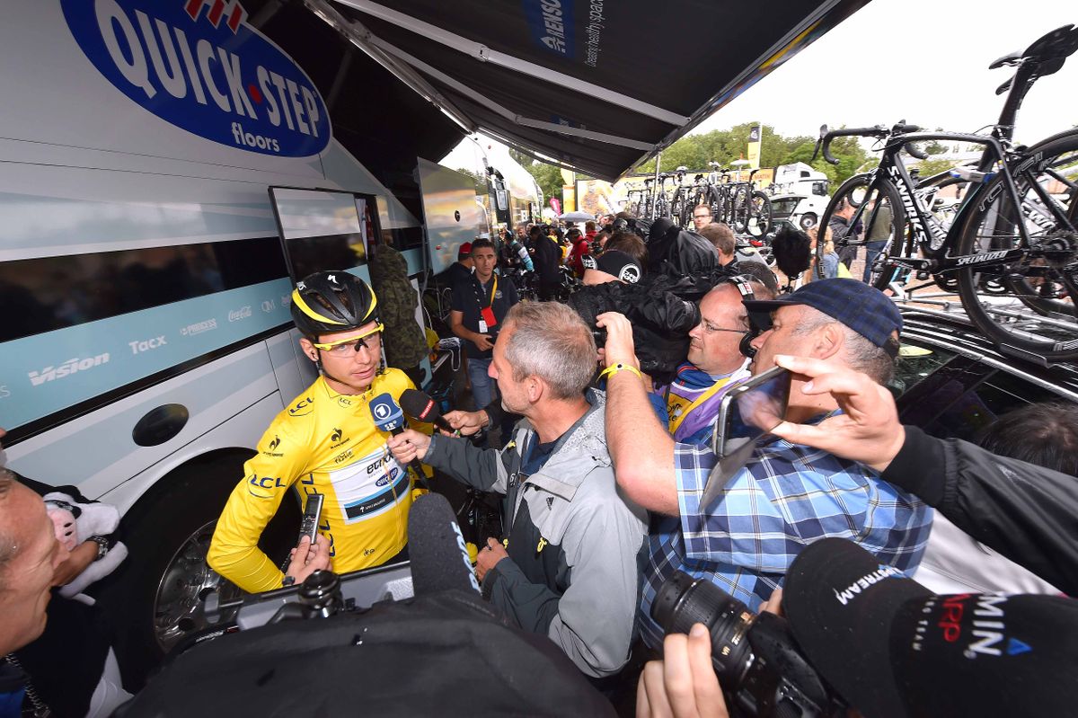 Tony Martin surrounded by fans and media at the Etixx bus