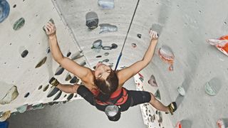 how to train for climbing: climber on indoor wall