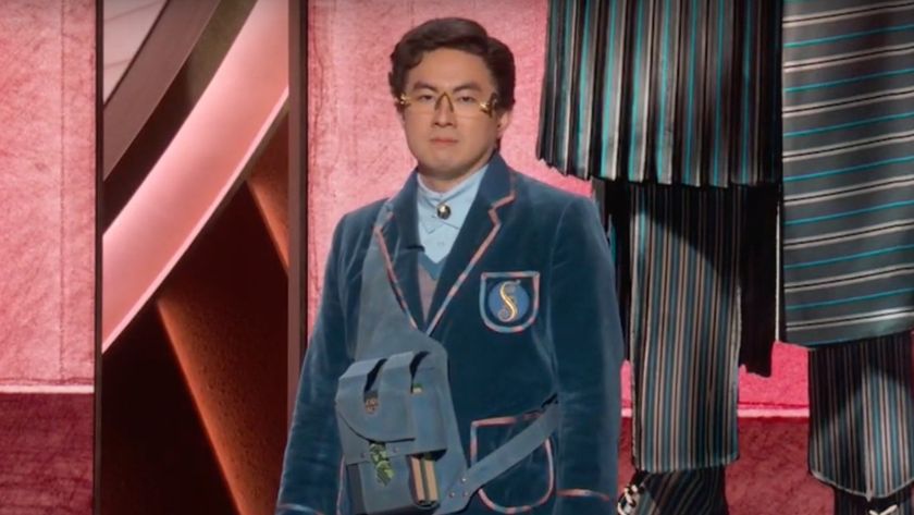 Bowen Yang dressed in his Wicked Costume while presenting at the 97th Oscars alongside other performers not in costumes. 