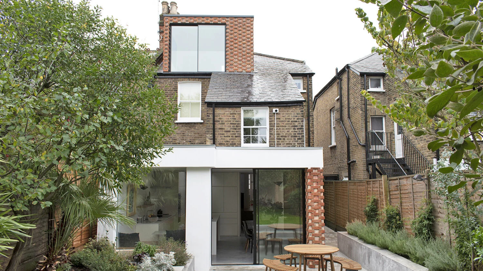 loft conversion with brick cladding on exterior matching extension below