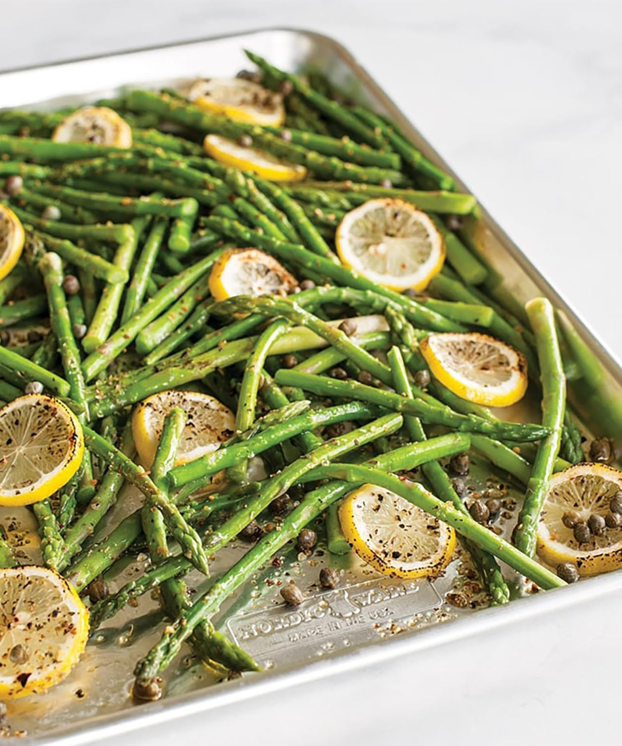 Nordic Ware baking sheet roasting green beans and sliced lemons
