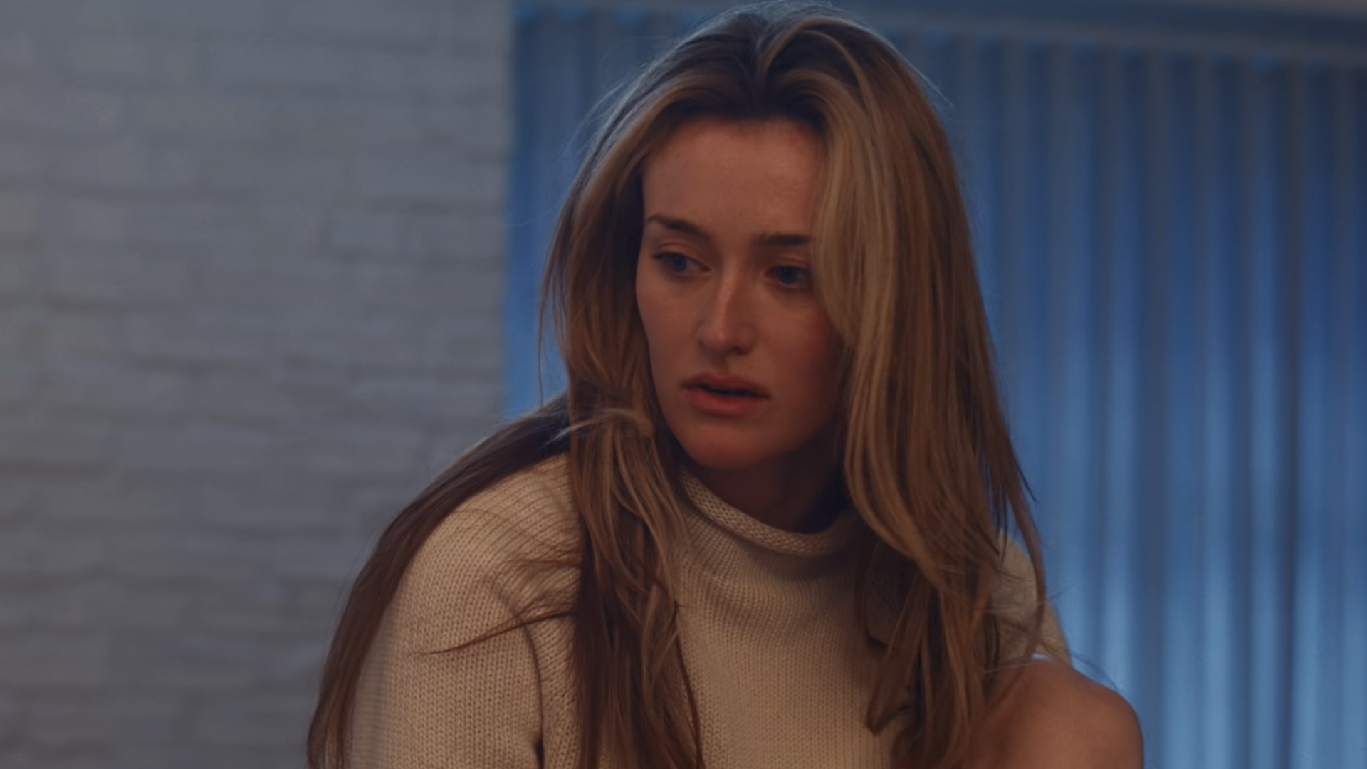 Carolyn Bessette-Kennedy in FX's Love Story wearing J.Crew's iconic rollneck sweater with John F. Kennedy Jr.