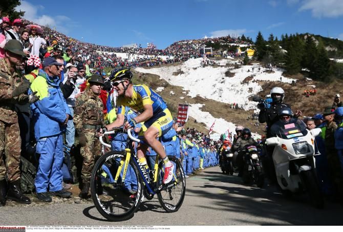Michael Rogers rides through the crowd on the Monte Zoncolan