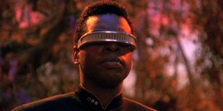 Geordi La Forge staring in a forest Star Trek: The Next Generation