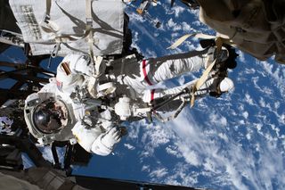 NASA astronaut Andrew Morgan is pictured working outside the International Space Station to finish up repairs to an ailing dark matter experiment called the Alpha Magnetic Spectrometer during a spacewalk on Jan. 25. He and European Space Agency astronaut Luca Parmitano spent 6 hours and 16 minutes working outside the orbiting lab in what was their fourth spacewalk together to repair the $2 billion experiment.