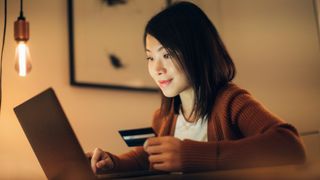 Young woman shopping online with laptop