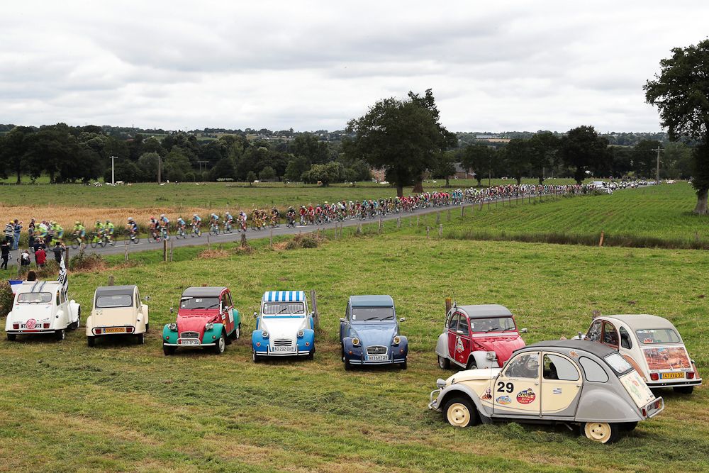 A vintage car display can't slow the Tour de France peloton