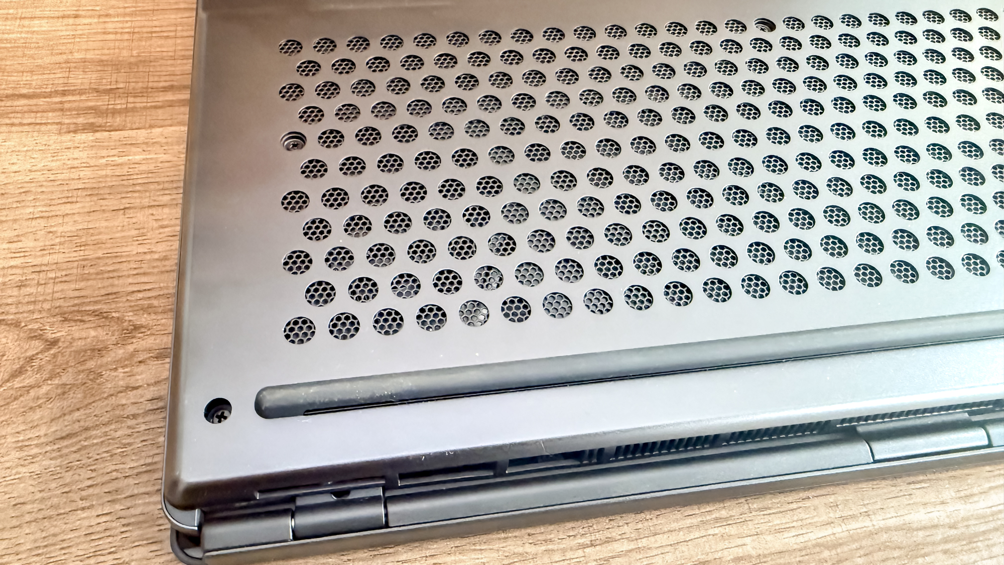 A closeup shot showing the thicker rear edge of the MSI Stealth 16 AI+ (2026)