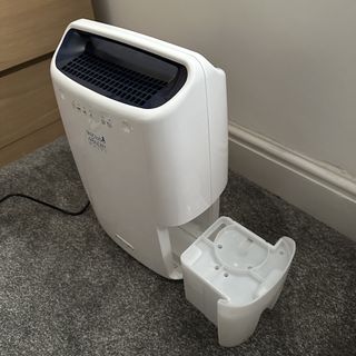 The white De’Longhi Tasciugo AriaDry Multi Dehumidifier with water tank removed