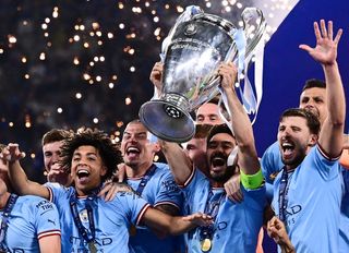 Ilkay Gundogan lifts the Champions League trophy after Manchester City's win over Inter in the 2023 final.