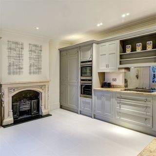 white drawing room with white cabinet and floor