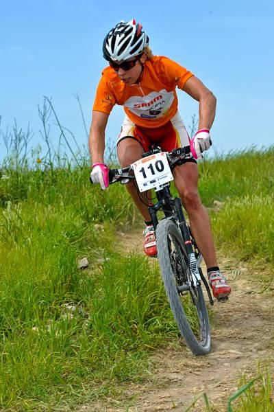 Annika Langvad, wearing the overall leader's jersey for the Sunshine Cup