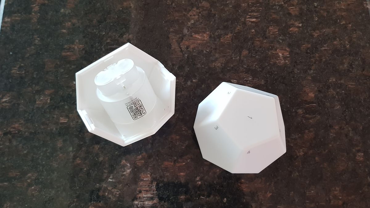 The 12-sided remote consists of two parts and is powered by two AA batteries