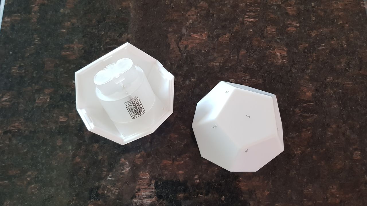 The 12-sided remote consists of two parts and is powered by two AA batteries