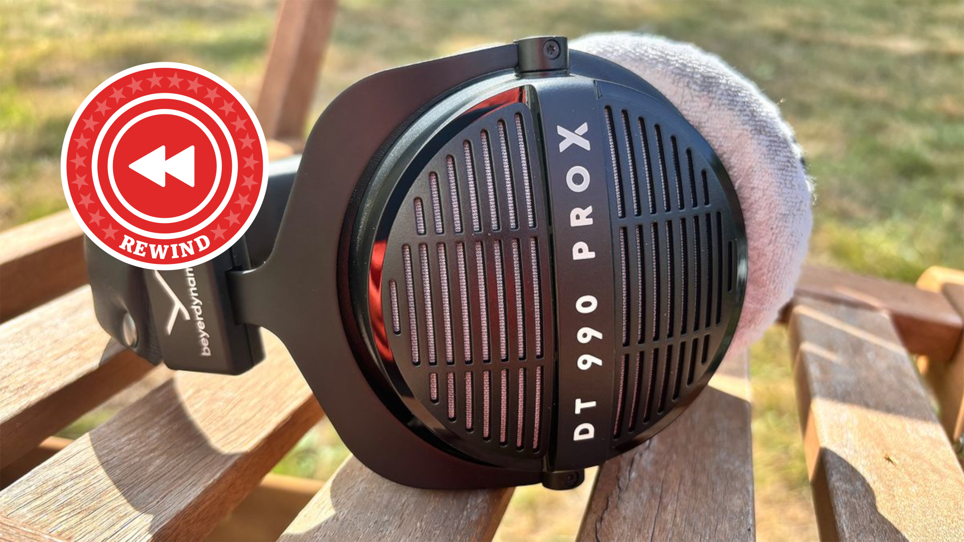 Beyerdynamic DT 990 ProX on table with Rewind logo
