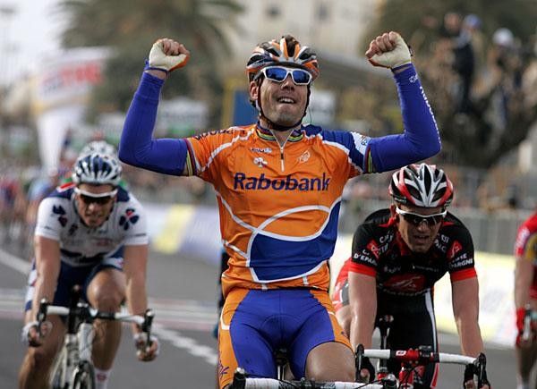 Freire lifts his arms as he beat Petacchi and Rojas.
