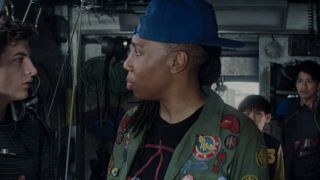 Lena Waithe talking to Tye Sheridan with her jacket of many patches on.