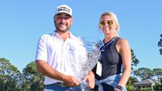 Stephen Jaeger and his wife Shelby with a tournament trophy