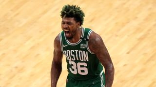 Marcus Smart #36 of the Boston Celtics reacts after a three point basket during the fourth quarter against the Miami Heat 