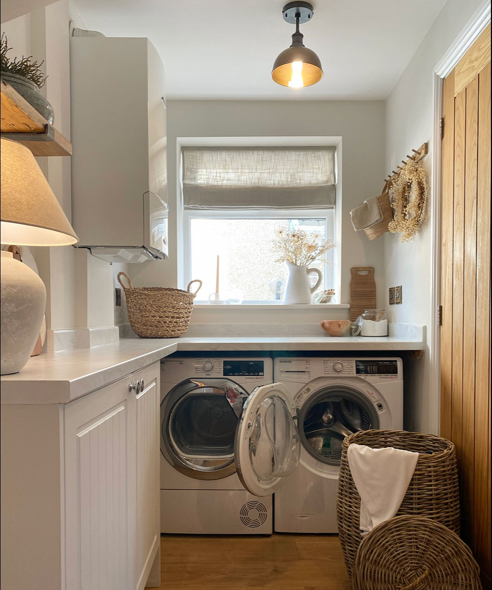 small utility room with side lamp and metal ceiling light