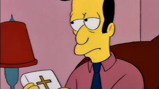 Reverend Lovejoy looking annoyed and holding a bible in The Simpsons.