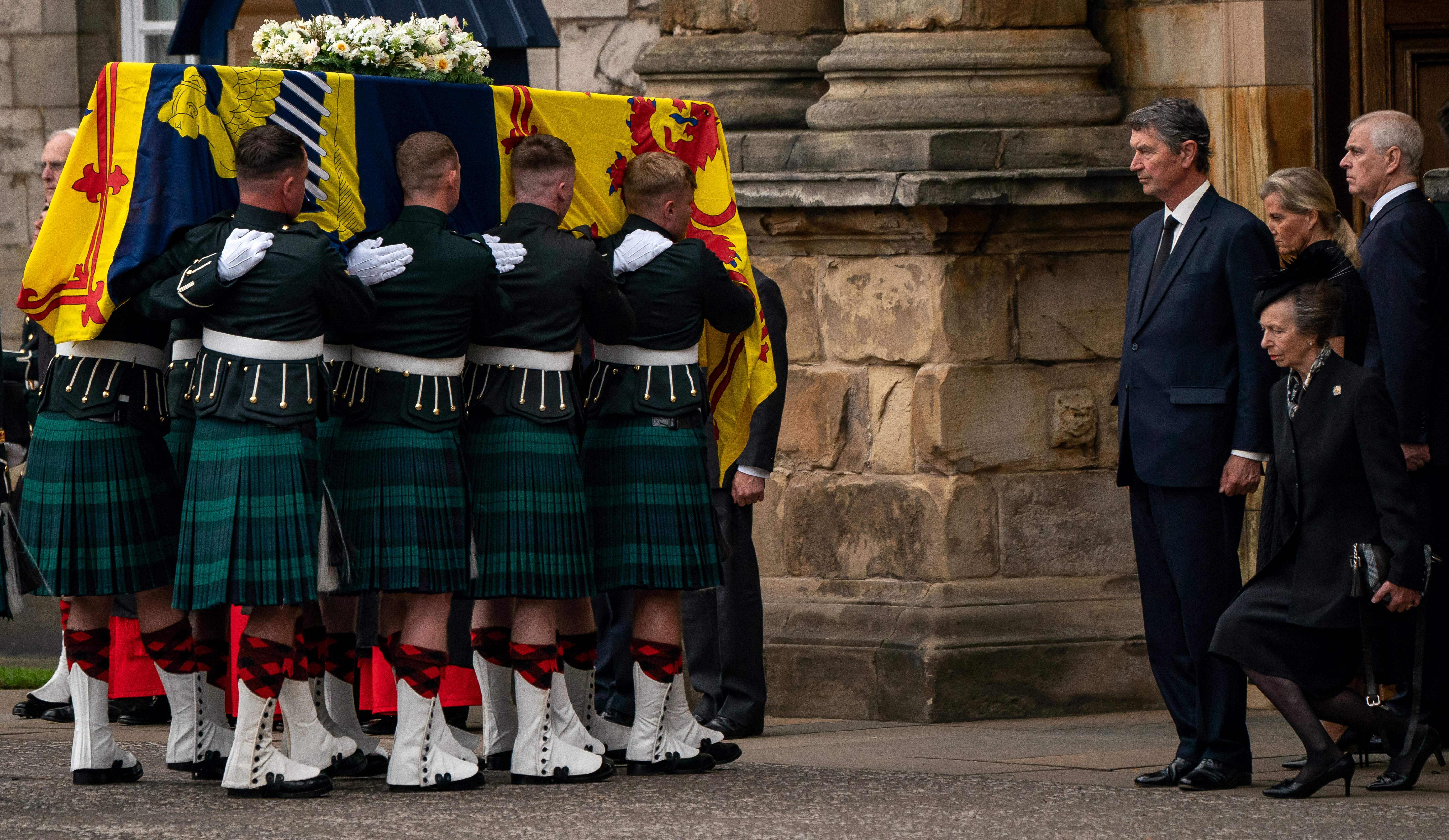 Princess Anne curtsying to Queen Elizabeth's coffin