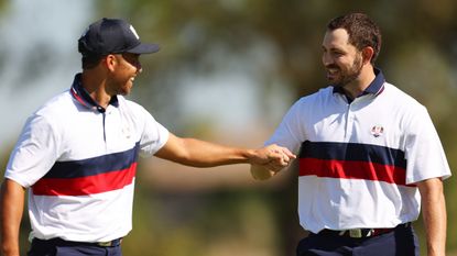 Xander Schauffele and Patrick Cantlay fist-bump at the 2023 Ryder Cup during a foursomes match