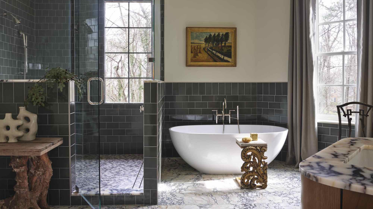 bathroom with freestanding bath and large shower enclosure and marble flooring