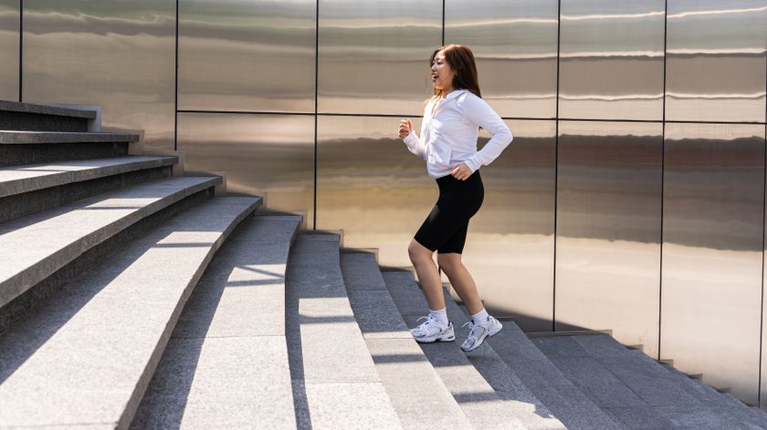 a woman walking up a set of stairs