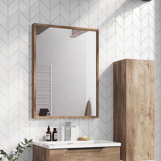 bathroom with mirror on patterned white wall